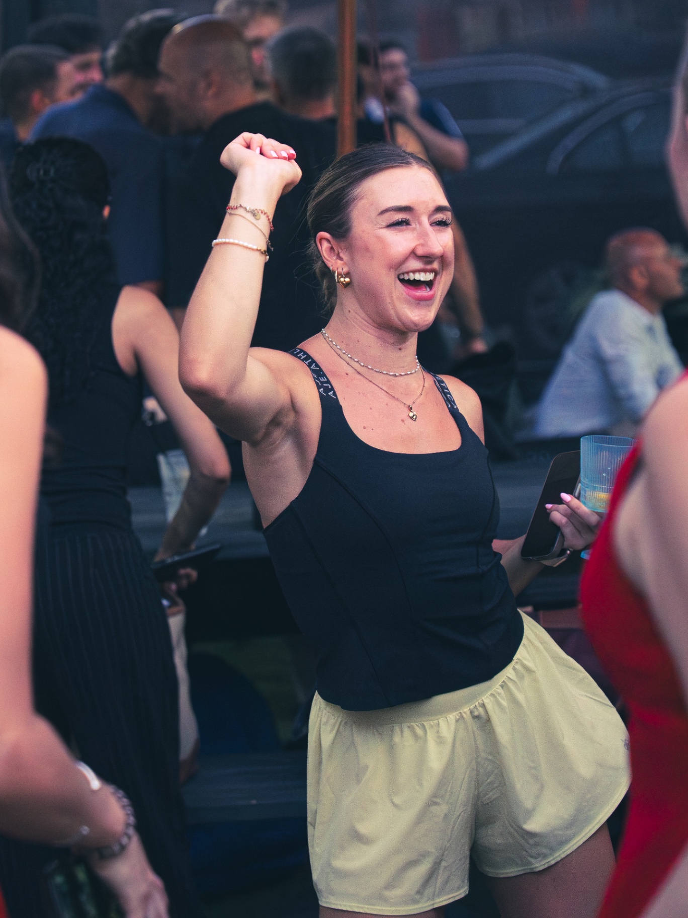 Guest celebrating with a fist pump at the post-match party