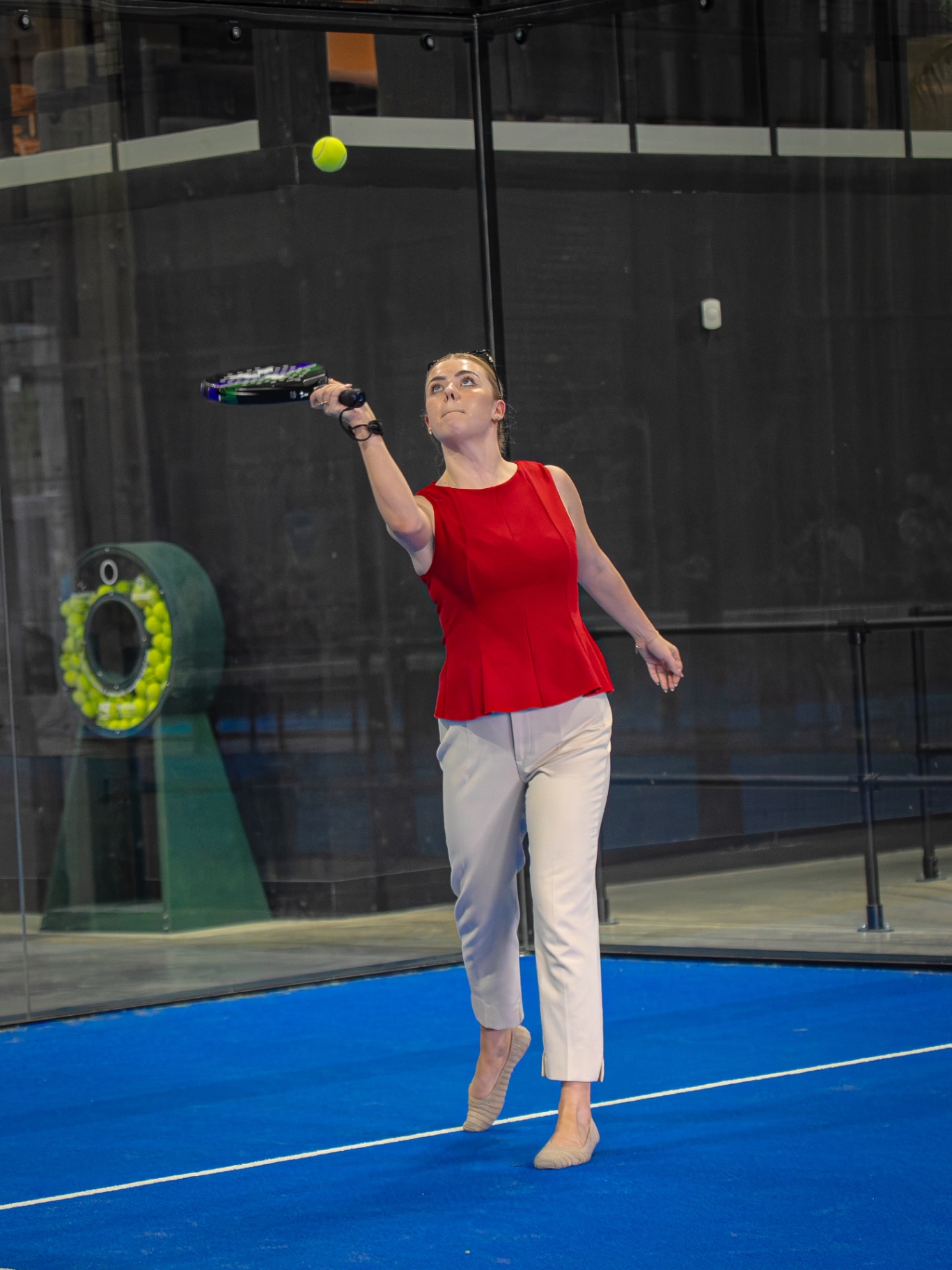 Guest hitting an overhead smash during a corporate padel match