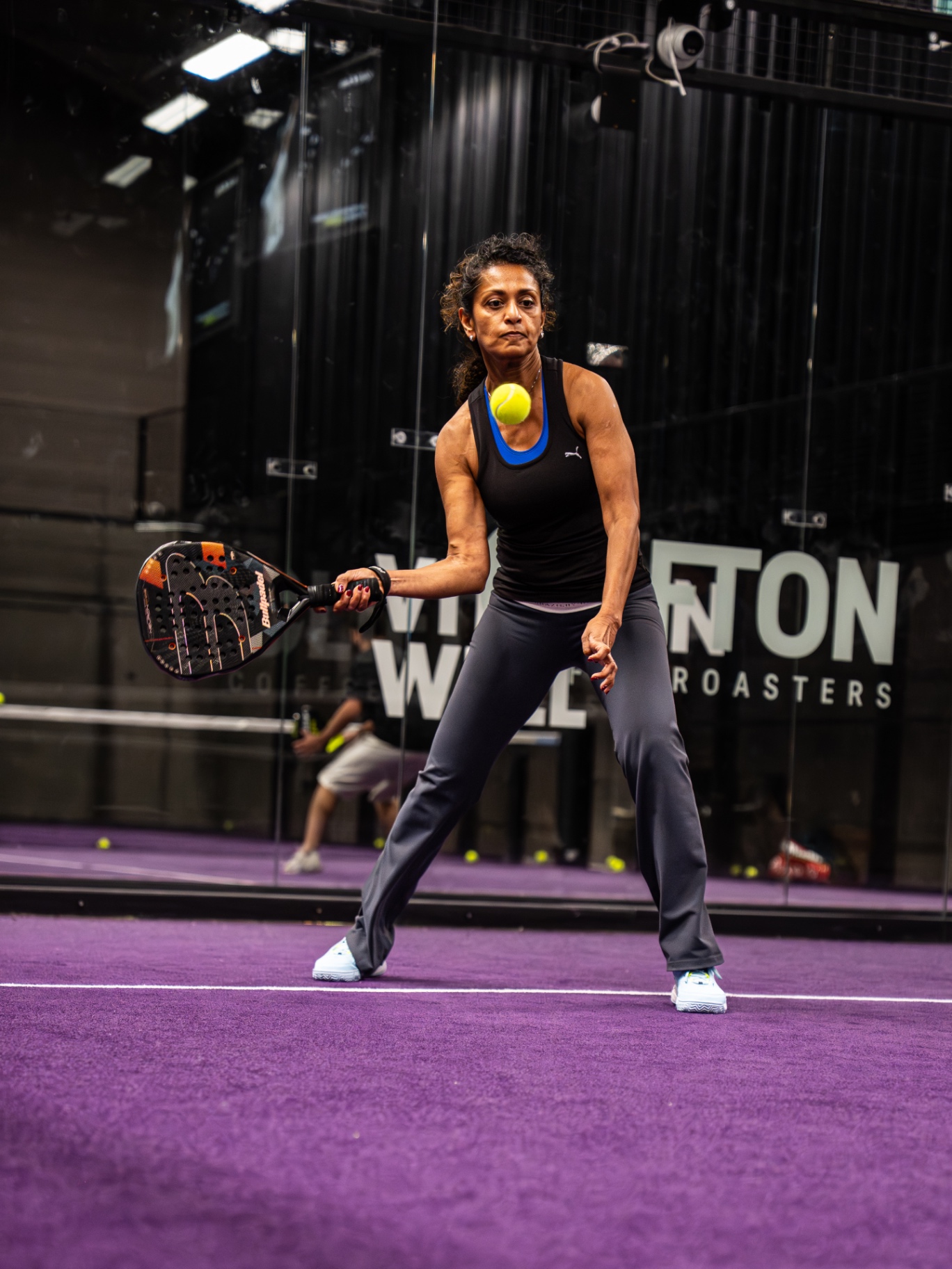 Player lining up a forehand return from the baseline
