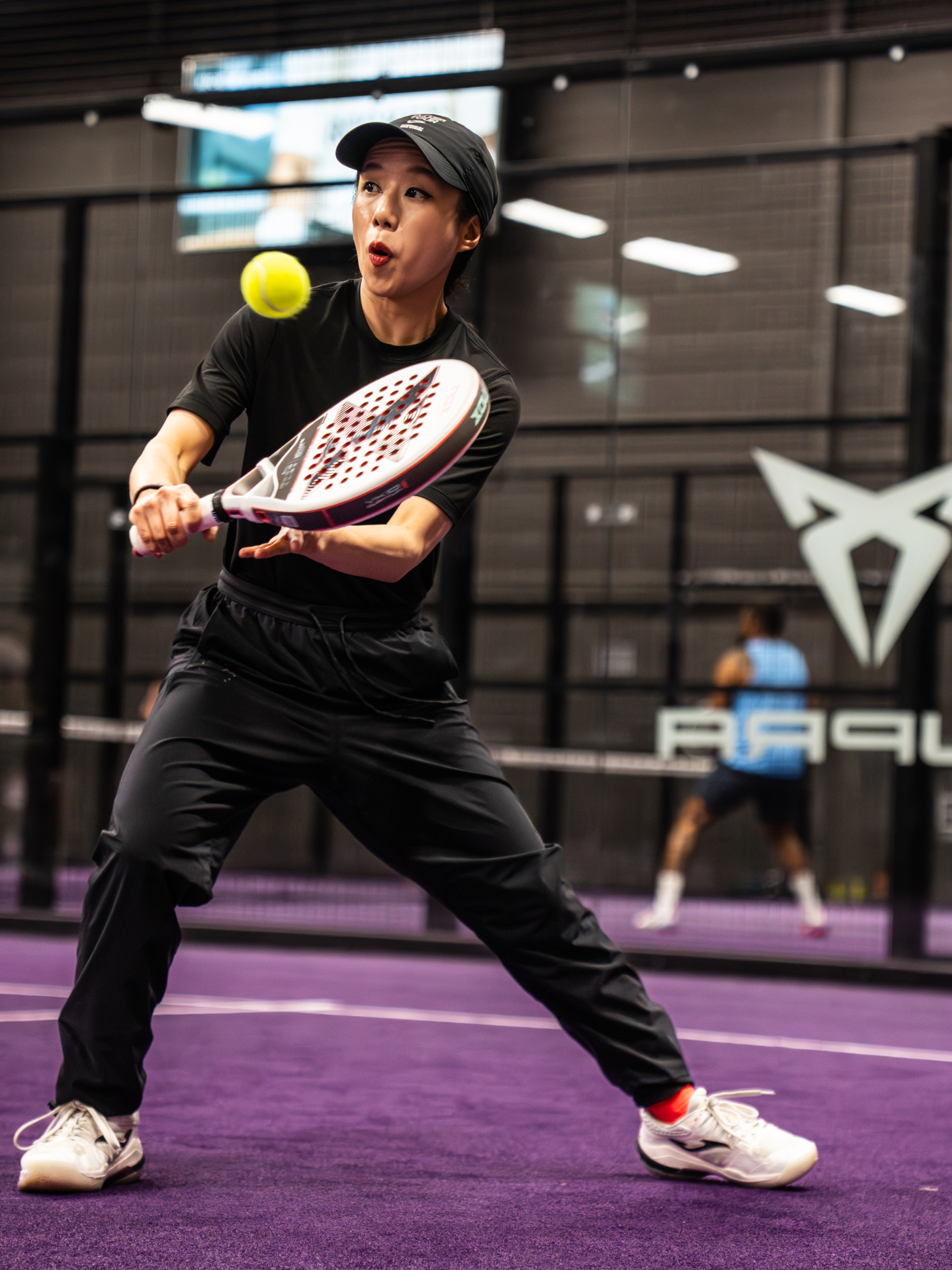 Player focused on returning the ball mid-rally