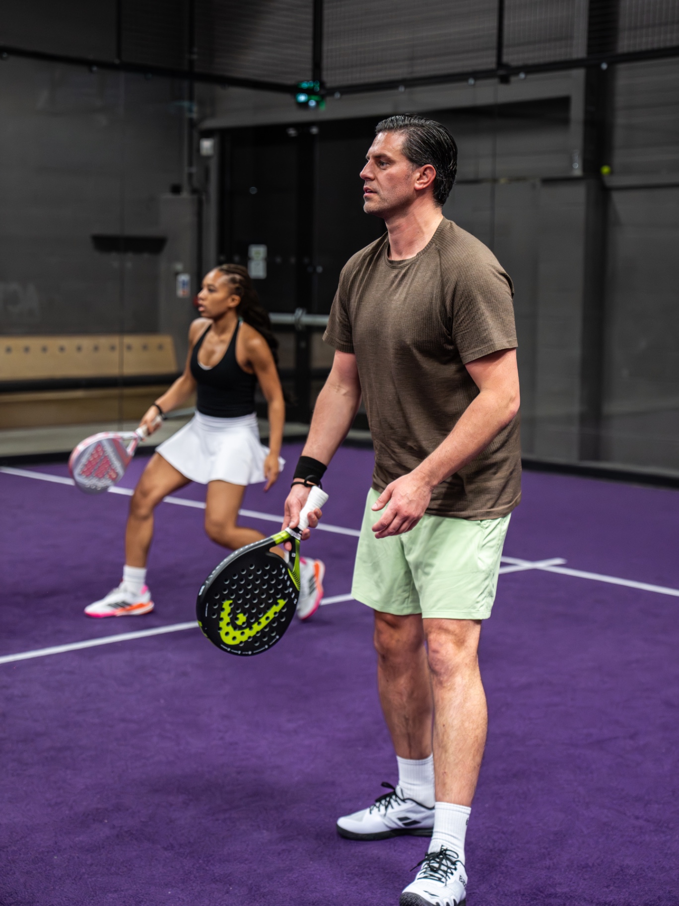 Doubles pair covering the court together during a rally